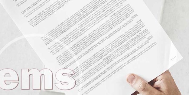 hand holding a copy of rules & regulations | hoa rules and regulations