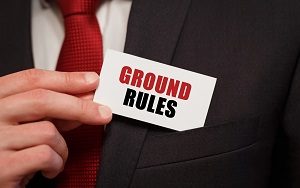 Businessman putting a card with text GROUND RULES in the pocket | hold an HOA board election