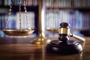 Gavel, scales of justice and law books | hoa rules and regulations
