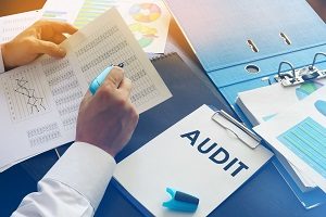 Document with title Audit on an office table | hoa accounting standards