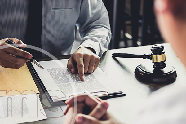 HOA Legal Responsibilities Every Homeowner Should Know man talking to employee pointing at document | hoa legal responsibilities