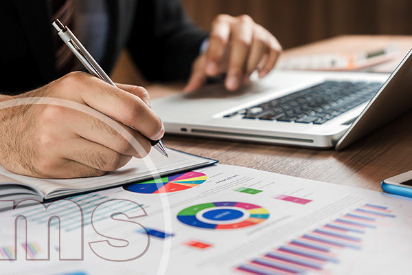 business person making a note on the desk | HOA Treasurer Report