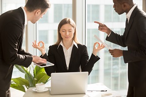 woman meditating in the middle of an argument of two men | issues at your hoa