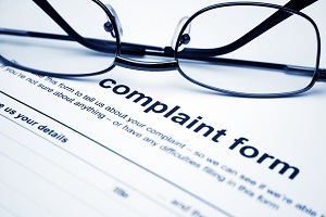 Complaint form with eyeglasses | issues at your hoa