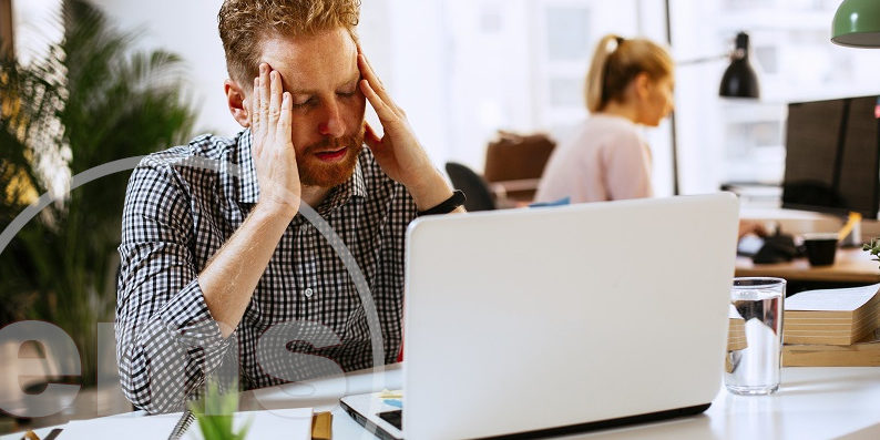 problematic man in front of laptop putting hands on head | issues at your hoa