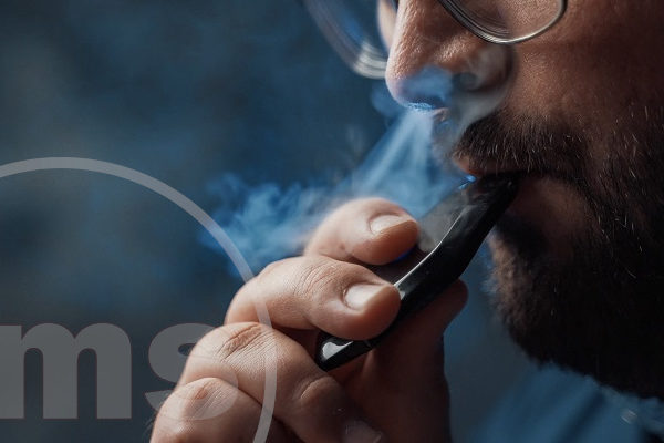 close up of vaping bearded man | HOA vaping rules