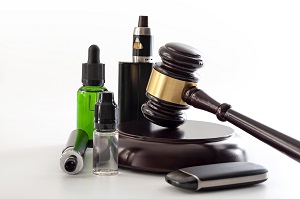 judge gavel, vape device and bottle of e-juice isolated on white background | vaping rules