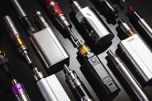 vaping device mod laid out on a surface | prevent vaping in HOA community