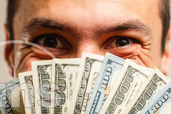 man with money on his face | hoa donations