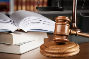 book and a gavel on a table | revise hoa rules