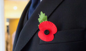 Red Poppy Pinned on to Suit Jacket - Memorial day